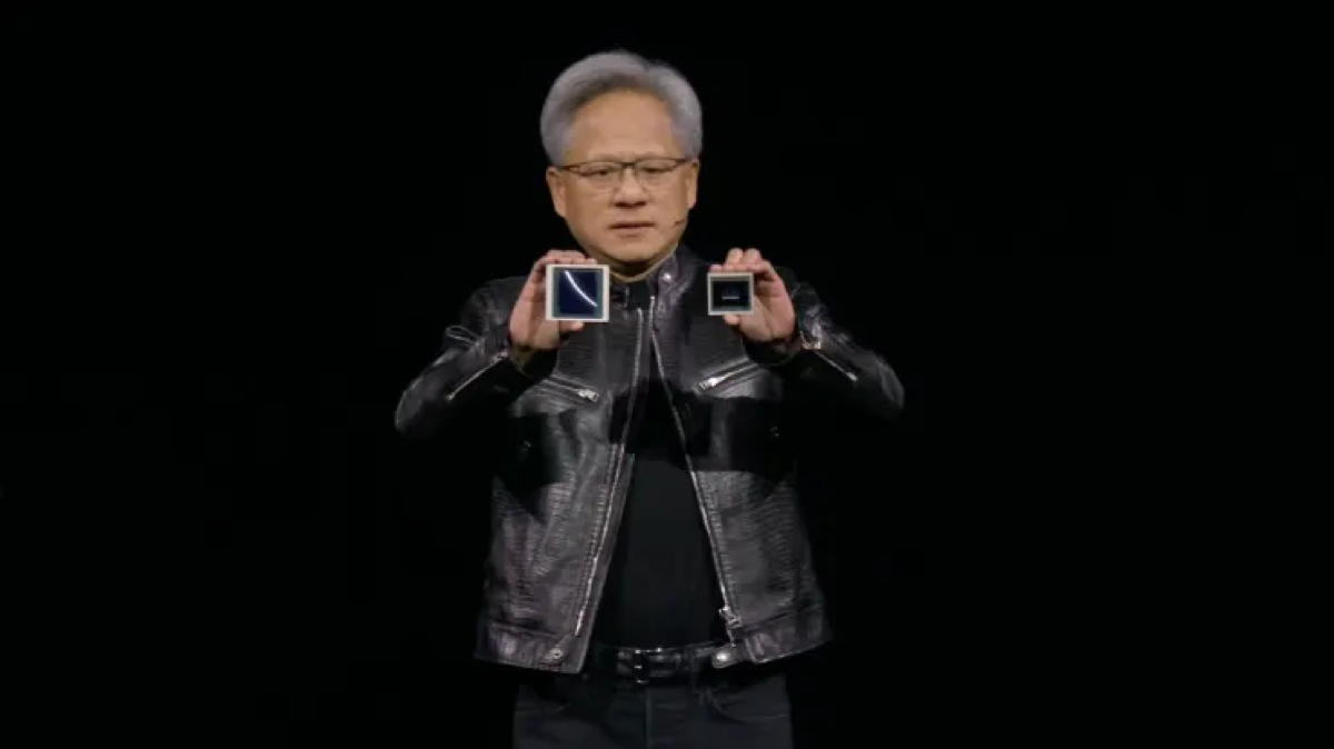 Nvidia chief executive Jensen Huang compares size of 'Blackwell' GPU to that of current 'Hopper' H100 chip at GTC developer conference in March 2024. Image credit: Nvidia